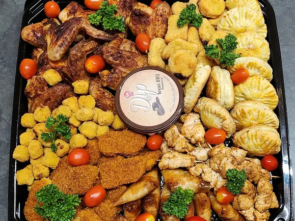 Savoury platter with chicken, potato wedges and dipping sauce
